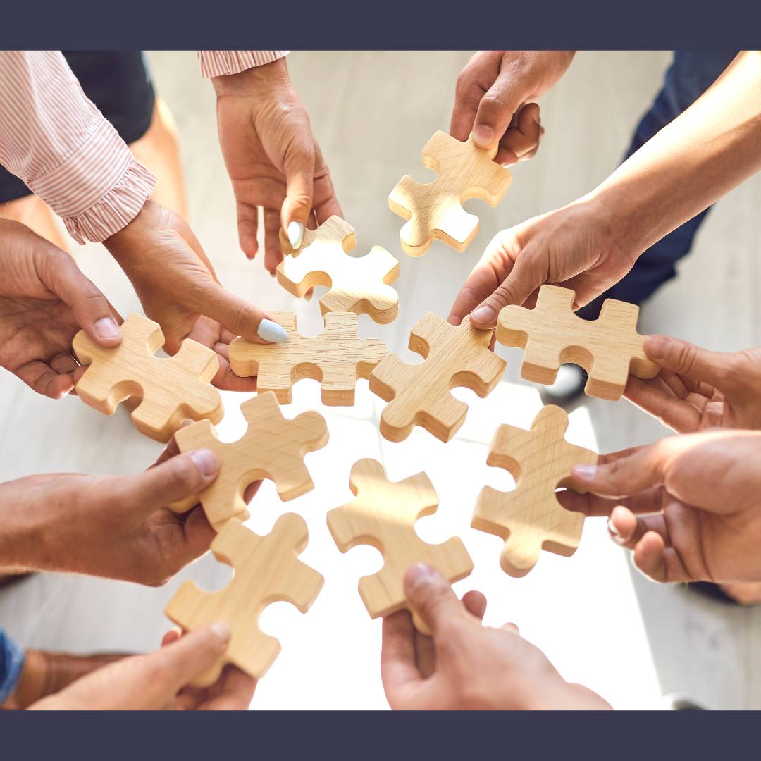 People holding puzzle pieces