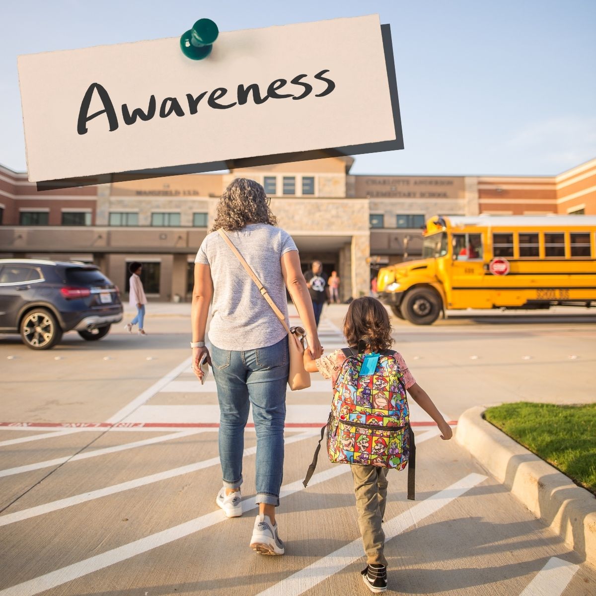 child and parent walking into school